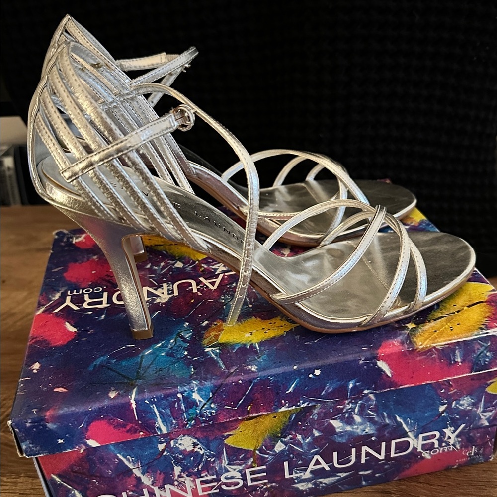 Chinese Laundry silver “Wesley” ankle strap heels.